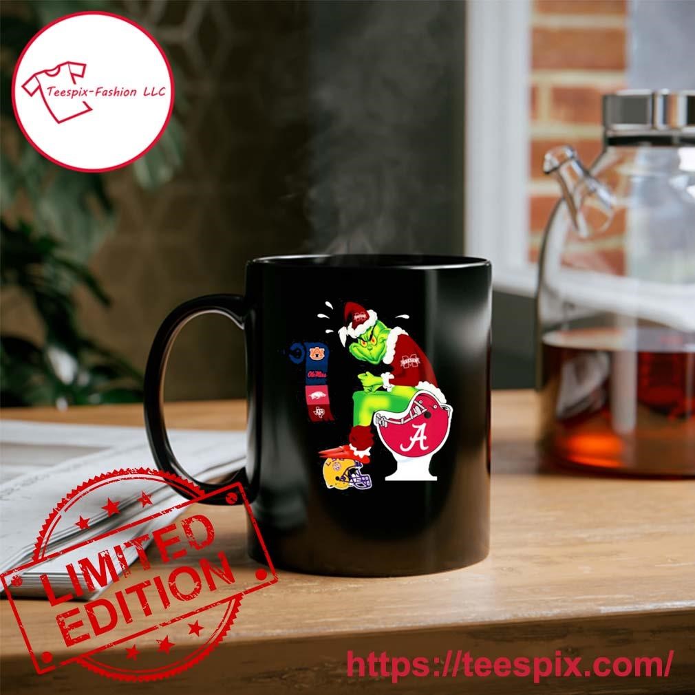 https://images.teespix.com/2023/11/The-Grinch-Mississippi-State-Bulldogs-Sitting-On-Toilet-Alabama-Christmas-Ornament-Custom-Name-Mug.jpg